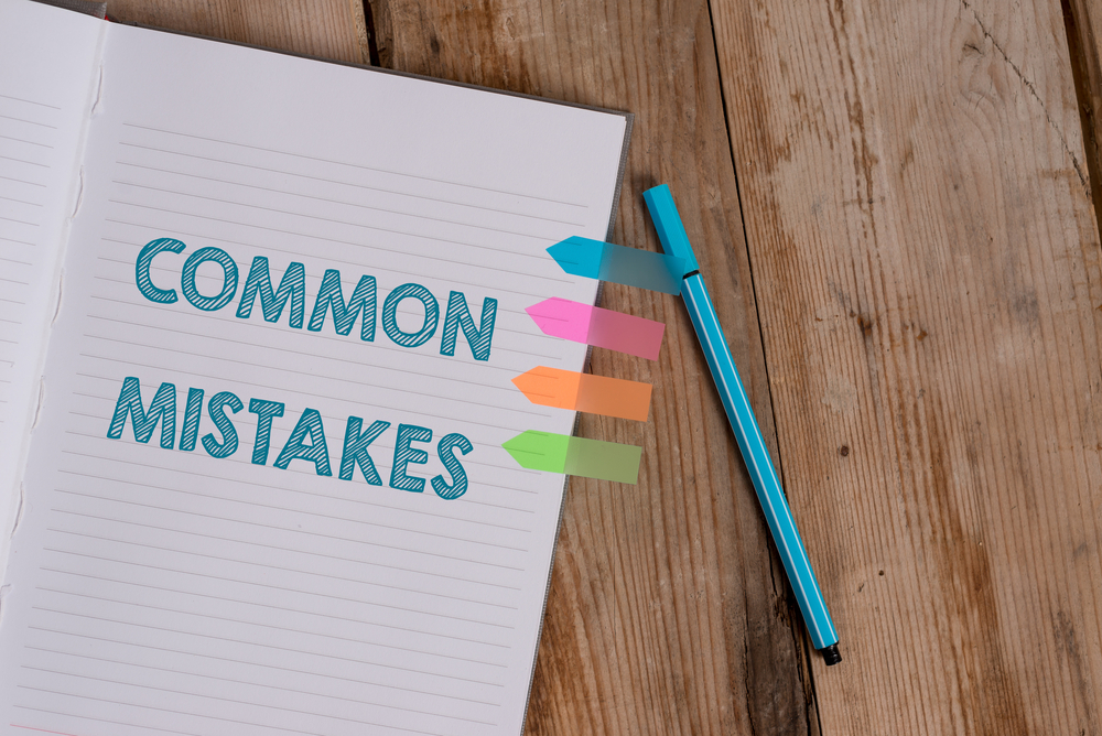 conceptual hand writing showing common mistakes. business photo text actions that are often used interchangeably with error striped notebook colored arrow banners ballpoint wooden background.