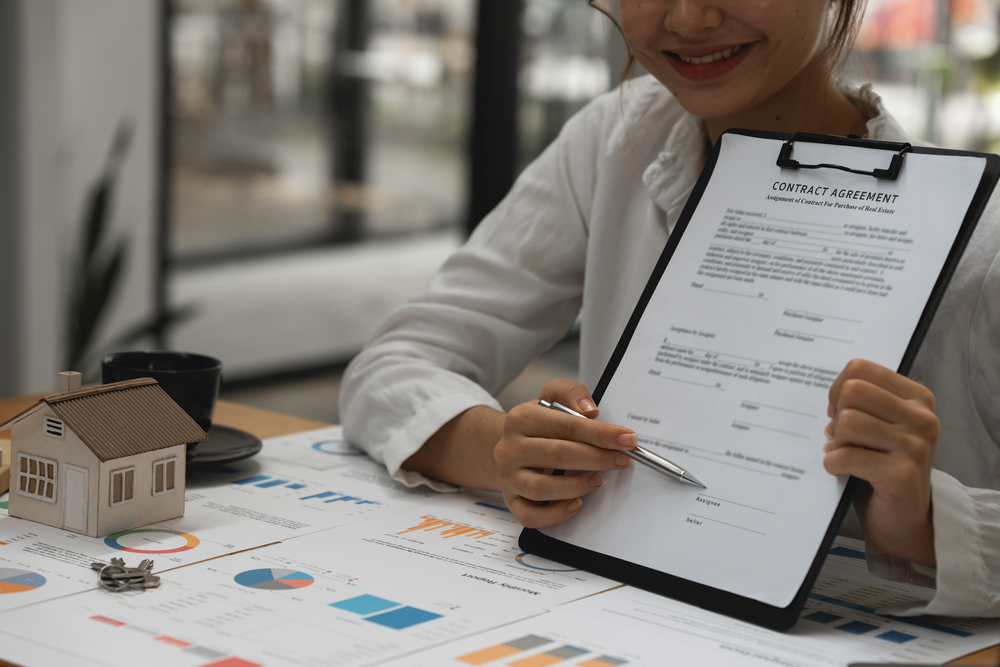real estate concept. businessman pointing at agreement contract.
