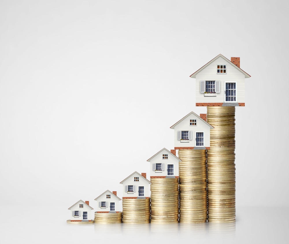 mortgage concept by money house from coins